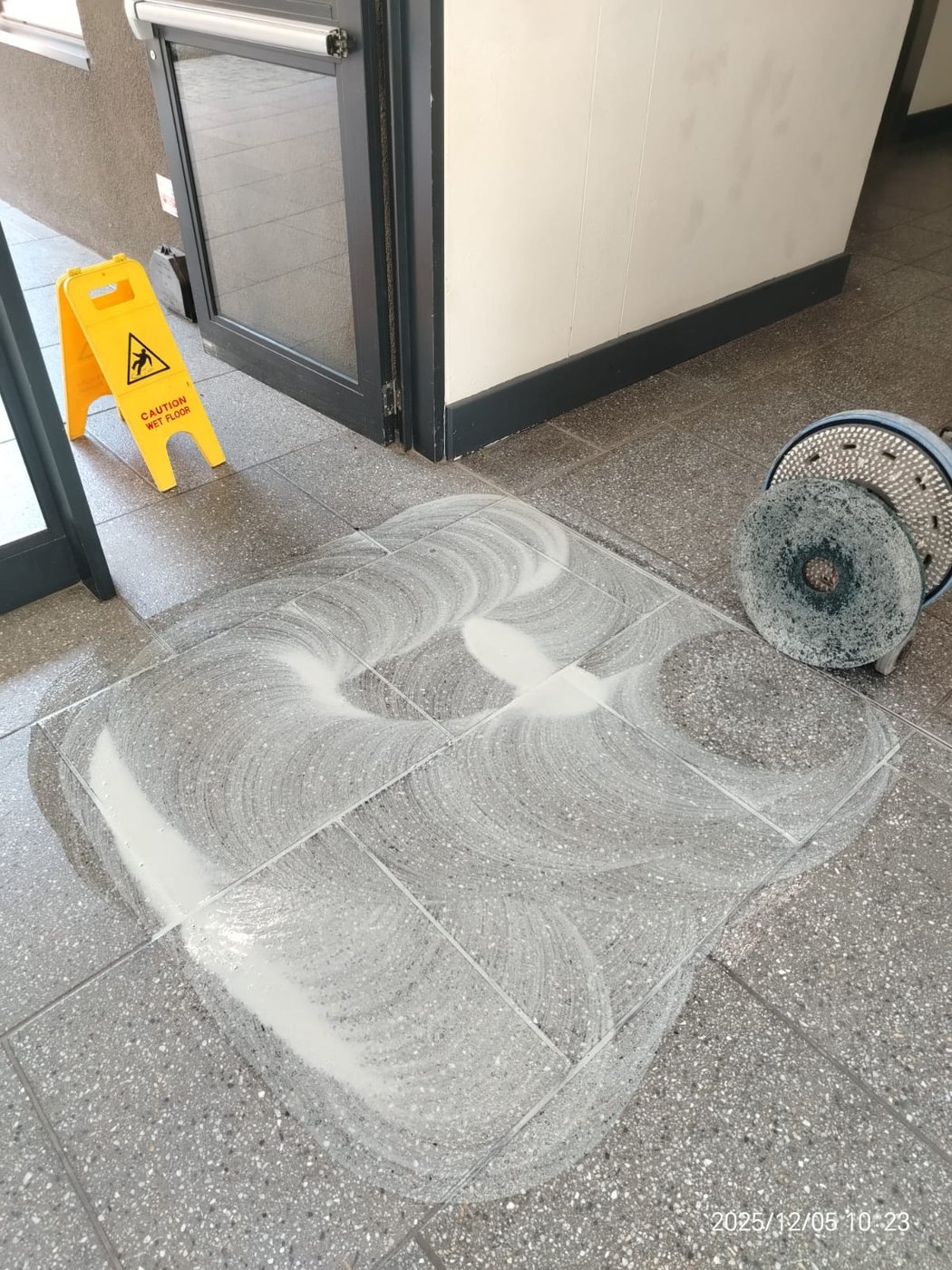 Machine-scrubbing years of build-up off hard floors