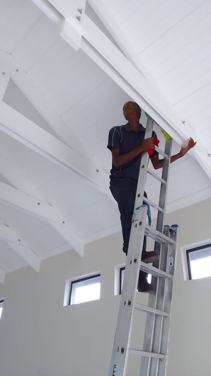 High interior walls reached safely by ladder